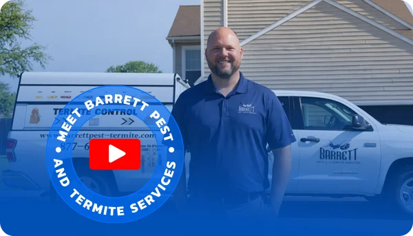 technician standing in front of company truck